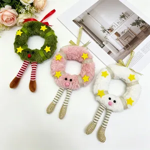 Detailed view of colorful plush Christmas wreath pendants with stars and striped legs