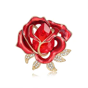 Elegant retro red crystal rose brooch with gold base and sparkling rhinestones