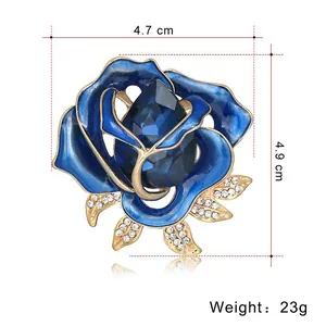 Blue crystal rose brooch with gold metal petals and rhinestones, size 4.7 x 4.9 cm