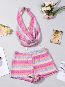 Detail of colorful wavy crochet knit bikini set with a golden starfish on the halter top
