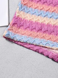 Detailed macro view of multi-colored crochet zigzag pattern on knitted fabric set