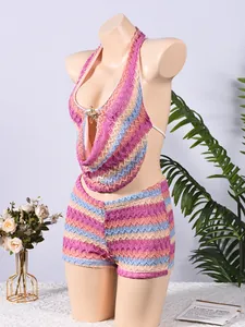 Detailed knit texture of colorful striped crochet vacation set with starfish metal accent