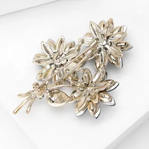 Back view of elegant floral bouquet brooch with rhinestone inlay and pin closure