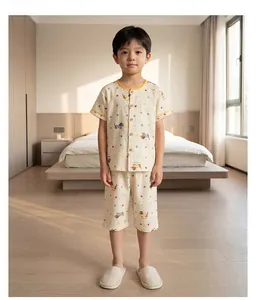 Close-up of kids cartoon print cotton pajama set with yellow piping details