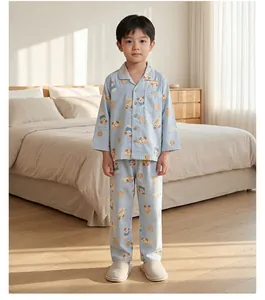 Close-up of boys light blue cotton pajama set with cute puppy and toast cartoon prints