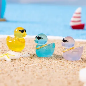 Miniature colorful duck figurines with sunglasses and gold chains for DIY micro landscapes