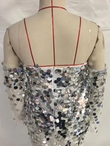 Detail of silver sequined evening gown with mesh sleeves and back invisible zipper