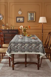 Close-up of American vintage jacquard tablecloth with paisley floral pattern and fringe