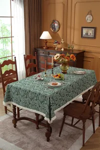 Close-up of vintage paisley pattern jacquard fabric with elegant white fringe trim