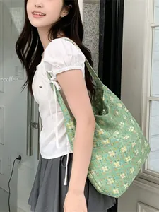 Fresh green floral canvas tote bag for students featuring a minimalist drawstring design