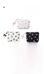 Close-up of quilted bubble texture fabric and bow embroidery on the cosmetic bag