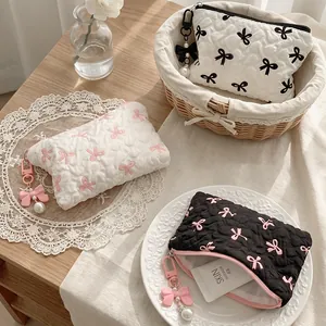 Quilted bow makeup bag with pearl pendant in black and white Korean ins style