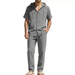 Detail of grey short sleeve hooded cotton linen shirt and matching pants set for men
