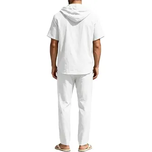 Rear view of men's white linen set featuring a short sleeve hoodie and drawstring trousers