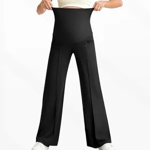 Detail of high-elastic belly support waistband on black maternity wide-leg pants