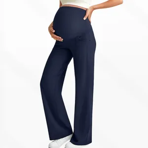 Detail view of high waist maternity wide leg pants with seamless belly support and pleats