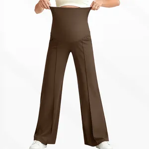 Detail of high-waisted stretchy maternity pants with wide belly support and flare leg