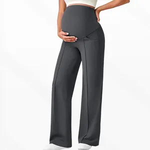 Detail of high waist maternity yoga pants with belly support and side pockets