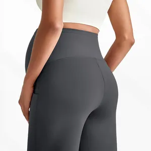 Close-up of high-waist maternity yoga pants with side pocket and V-shaped back seam