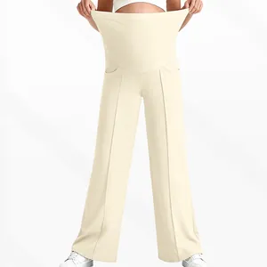 Detail of high waist maternity pants with stretchy belly support in beige color