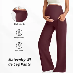 Detail showing high elastic belly support and deep red maternity wide leg pants fabric