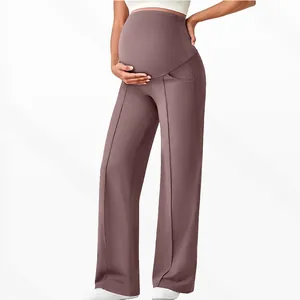 Detail view of high waist maternity pants with wide leg fit and front decorative stitching