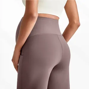 Detail view of high waist maternity yoga pants with side pockets and matte fabric