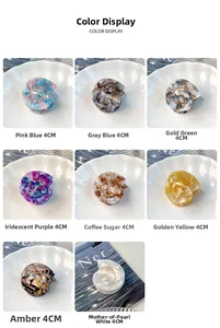 Detail display of 4cm shell-shaped acetate hair claws in 8 diverse colors and patterns