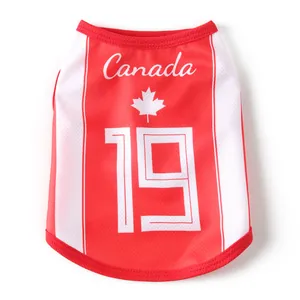 Detail of breathable red and white Canada mesh pet vest with maple leaf and number 19