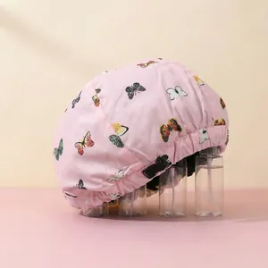 Pink waterproof shower cap with colorful butterfly print and adjustable elastic drawstring