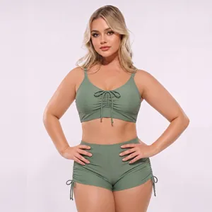 Detail of high waisted two-piece swimsuit with adjustable drawstrings and ruching