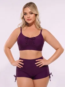 Women's two-piece plus size bikini set with high-waisted shorts in dark purple color