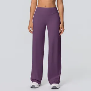 Detail of high-waisted dark purple yoga flare pants with wide waistband and draped fit