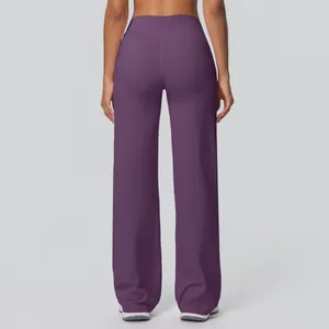 Rear view of purple high waisted flared yoga pants featuring slim fit double brushed fabric