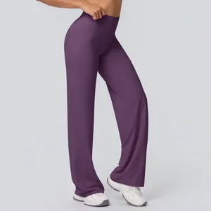 Detail view of high waist waistband and side profile on dark purple flared yoga pants