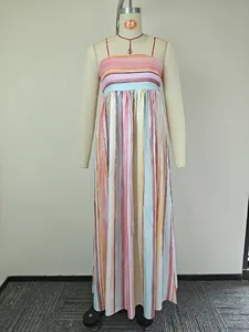Detail of colorful vertical stripes on a strapless maxi dress with pleated waistline