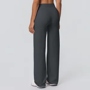 Rear view of high-waisted wide leg yoga pants in dark grey with flattering seam detail