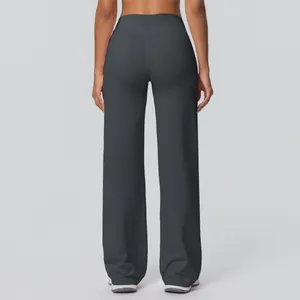 Close-up of high-waist yoga pants with V-shaped back seam and dark grey flared design