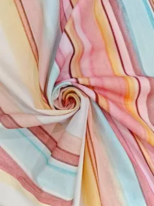 Close-up of lightweight pleated floral dress fabric with vibrant colorful stripes