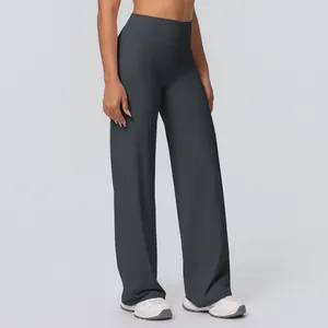 Macro view of high-waist flared yoga pants in dark grey with soft brushed fabric texture