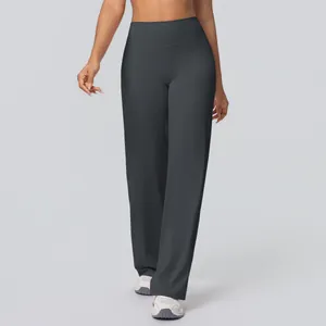 Detail of high-waisted wide-leg yoga pants in dark grey brushed breathable fabric