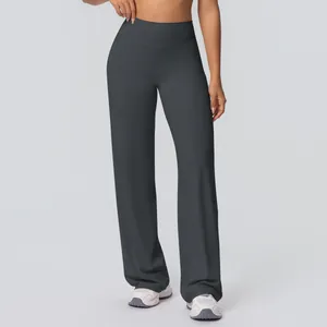 Detail of high-waist wide-leg yoga pants showing dark grey brushed fabric texture