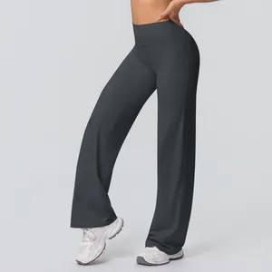 Detail of high-waist yoga pants featuring wide waistband and premium dark grey fabric