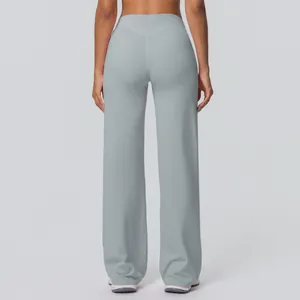 Detailed back view of high-waisted flared yoga pants with V-shaped stitching in light blue