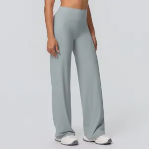 Close-up of Morandi blue yoga flare pants showing elastic high waist and soft texture