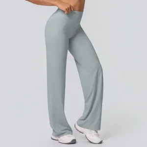 Side view of high waisted flared yoga pants in light gray with smooth brushed fabric