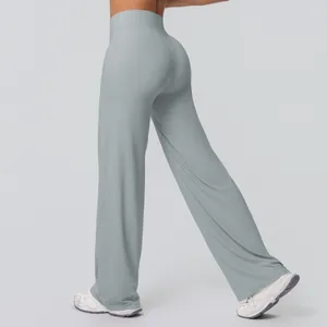 Detail of high waisted yoga flare pants with butt-lifting V-seam in light grey fabric
