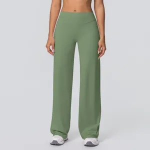 Detail of high waisted wide leg yoga pants in grey-green with matte fabric texture