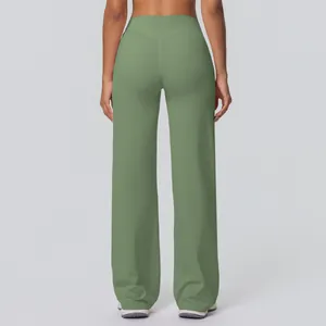 Detail showing the back V-shaped stitching on high-waisted sage green yoga flare pants