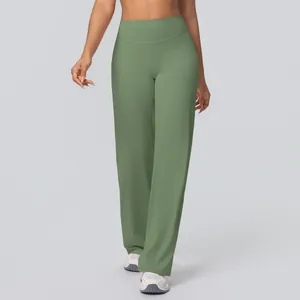 Close-up of sage green high-waisted flared yoga pants with brushed texture fabric